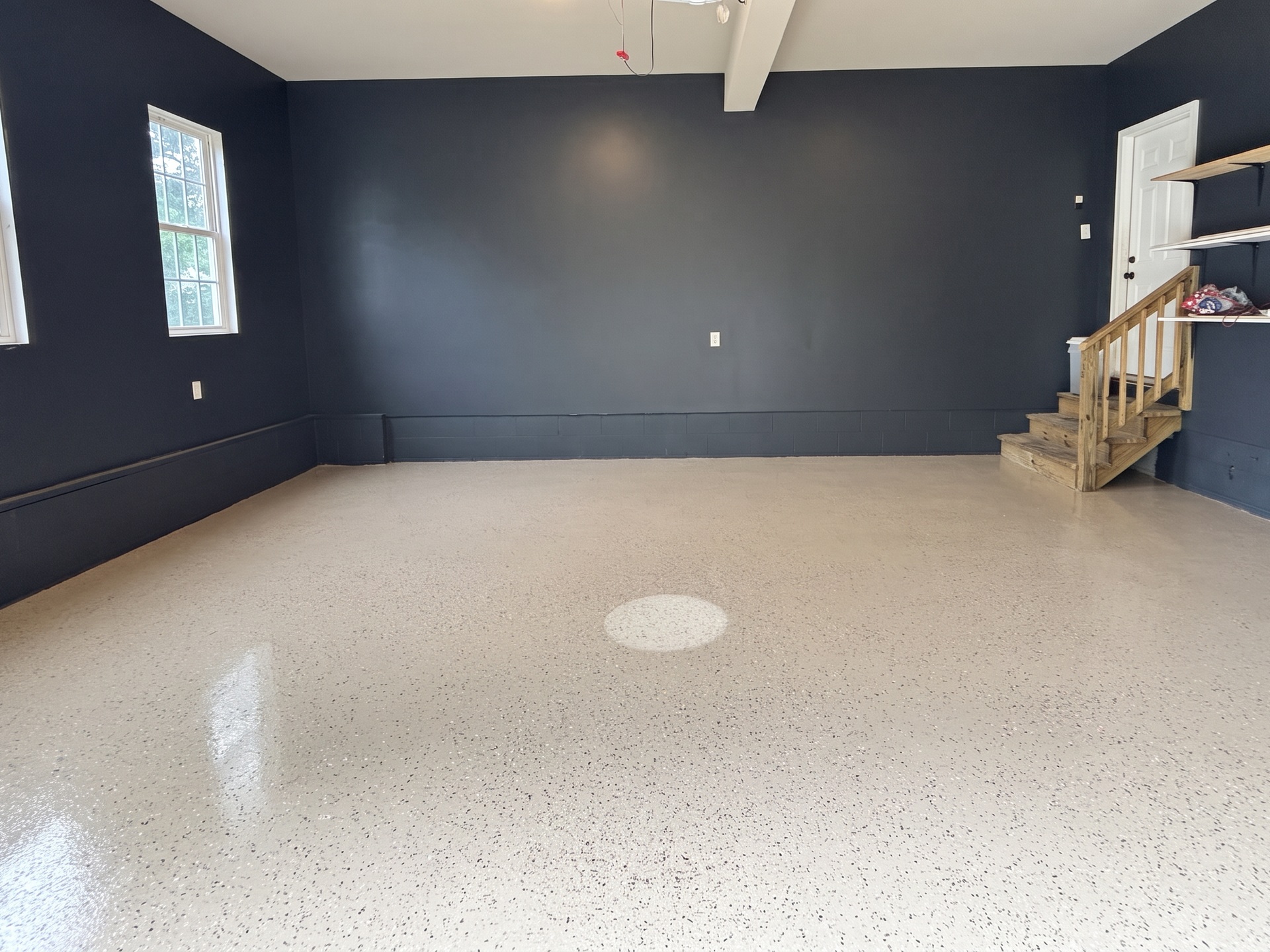 Same garage after a full-broadcast flake floor coating