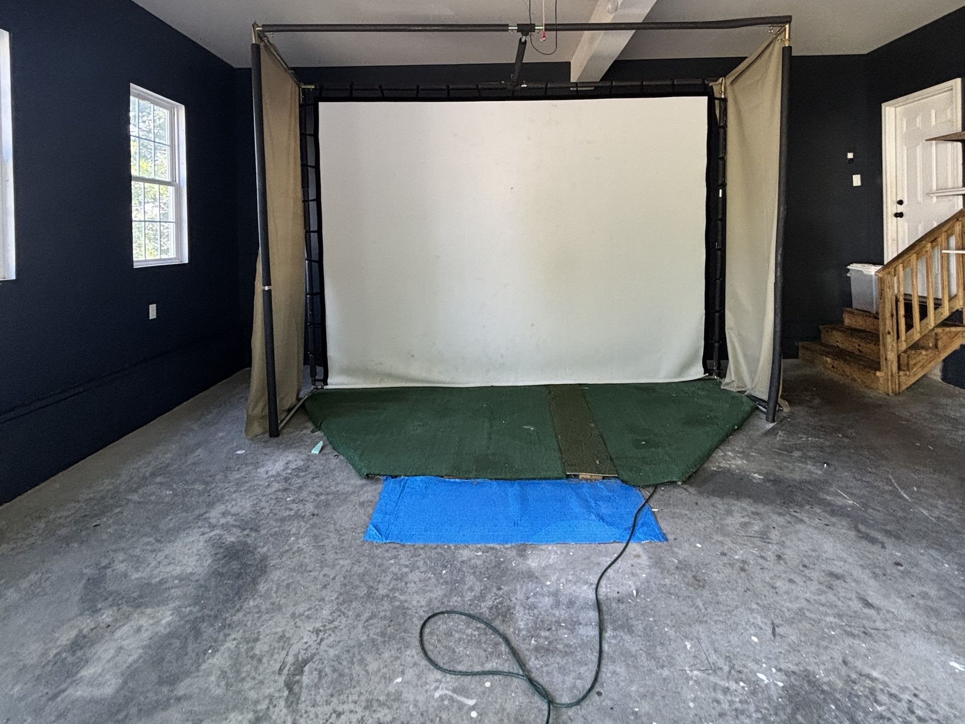 Bare, stained concrete garage floor before coating
