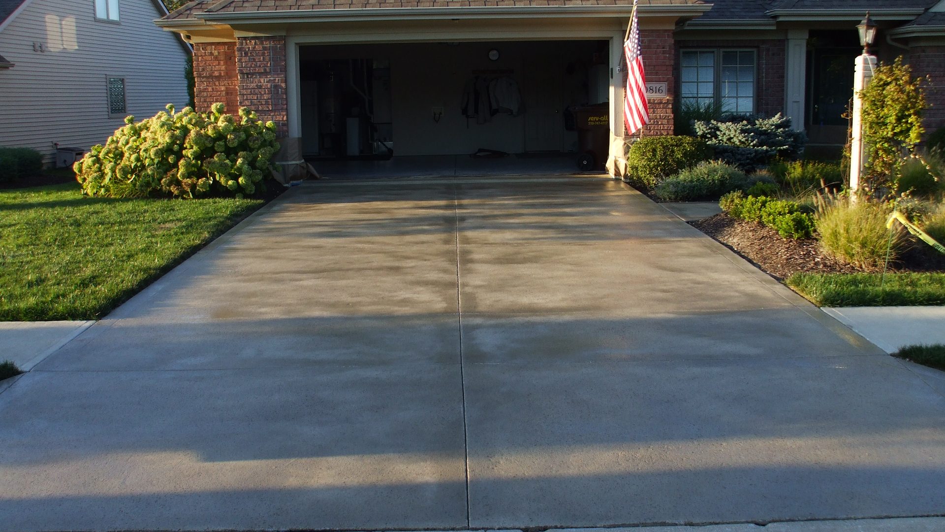 Concrete driveway leading to a residential garage