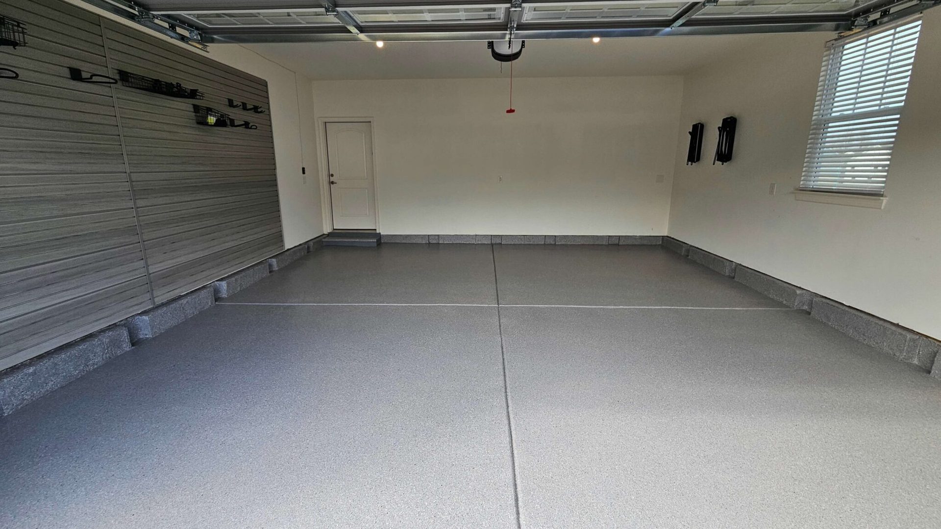 Two-car garage with a seamless gray floor coating